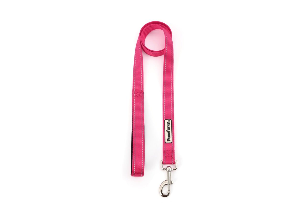 Pink dog leash with a clip on a white background
